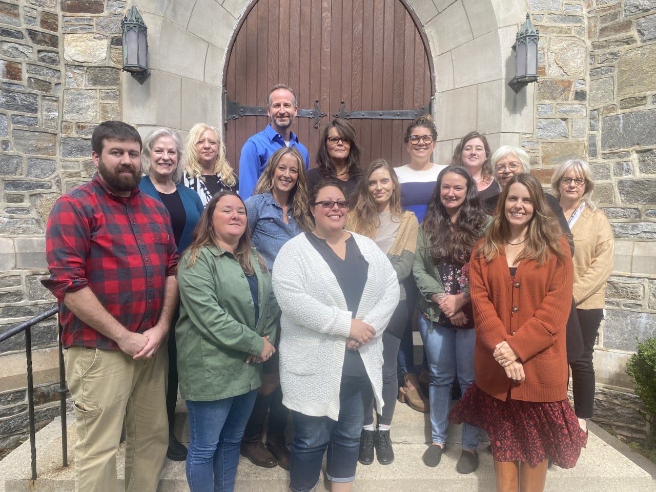 Greenwoods Counseling & Referrals team gathered on the steps of St. Michael's Church in Litchfield
